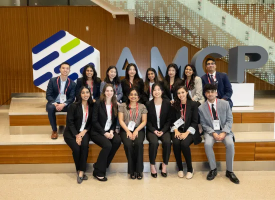 Members in front of AMCP Letters during 2023 Annual Meeting