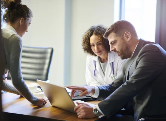 Doctors and business people working on research